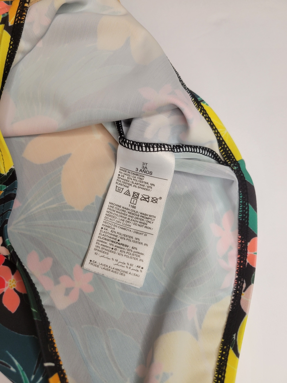 Old Navy toddler girl's long-sleeve, one-piece swimsuit featuring a black floral - Picture 3 of 6